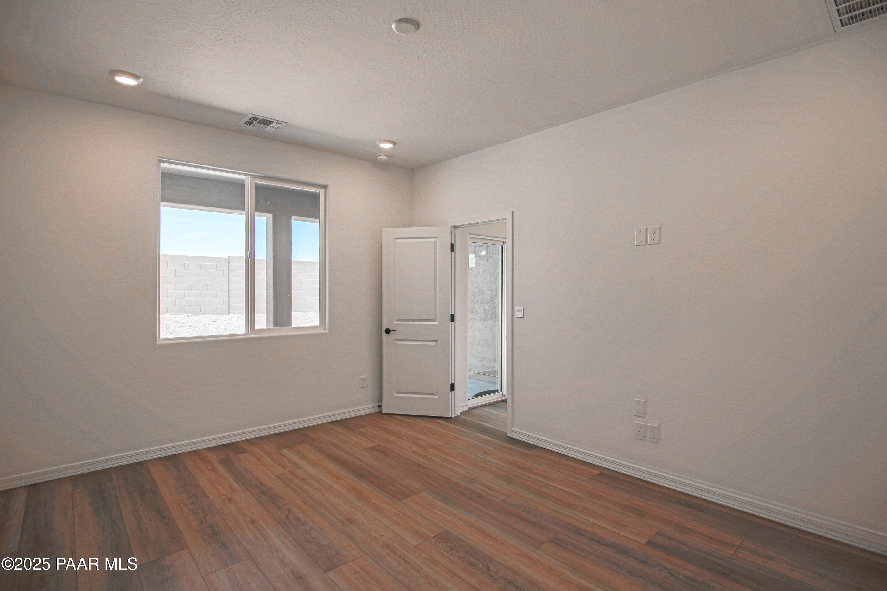 1224 Woodchute Road Prescott, AZ 86305 - Photo 19 of 43 wooden floor in an empty room with a window