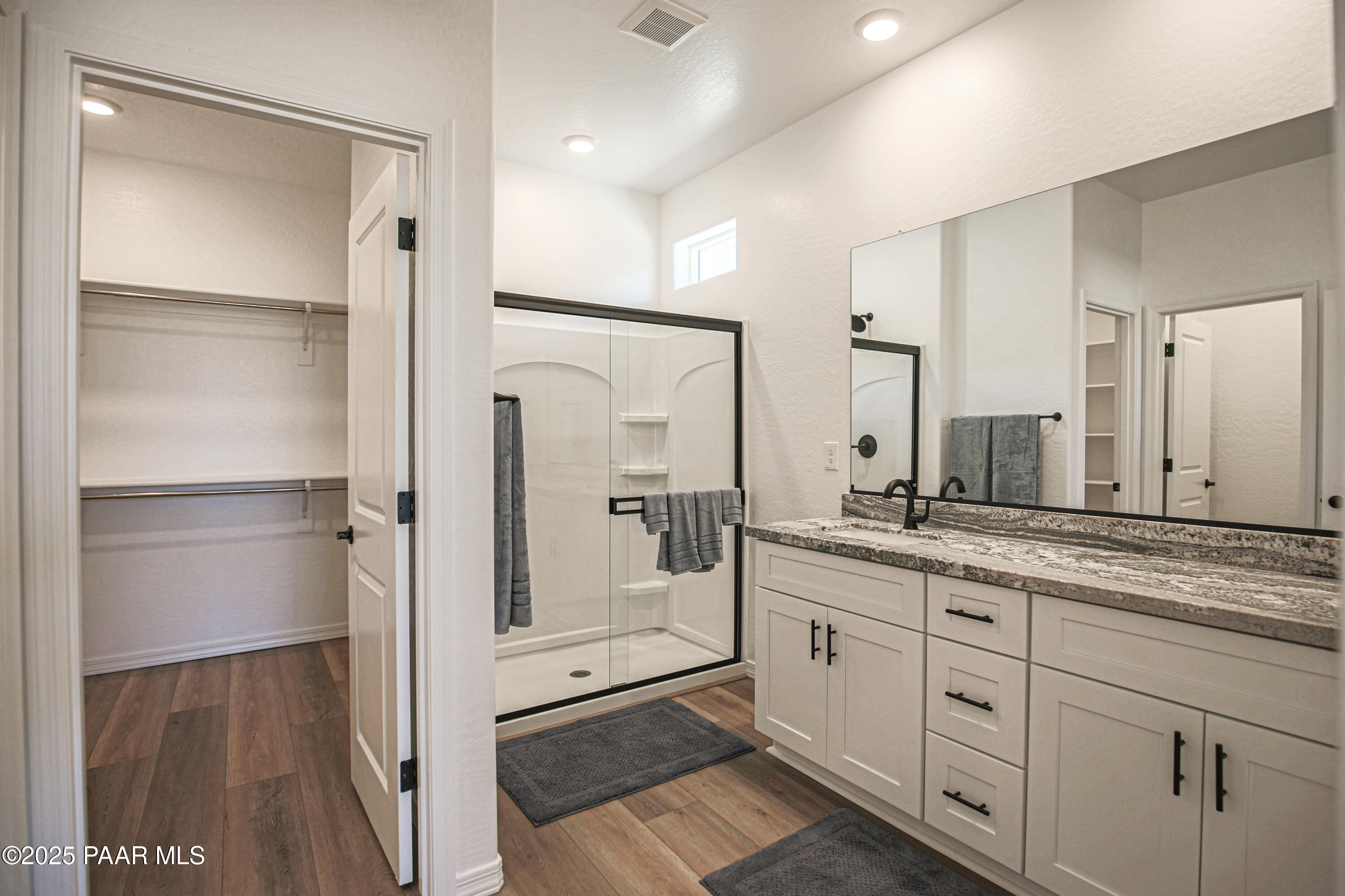 1224 Woodchute Road Prescott, AZ 86305 - Photo 20 of 43 a spacious bathroom with a granite countertop sink mirror and double