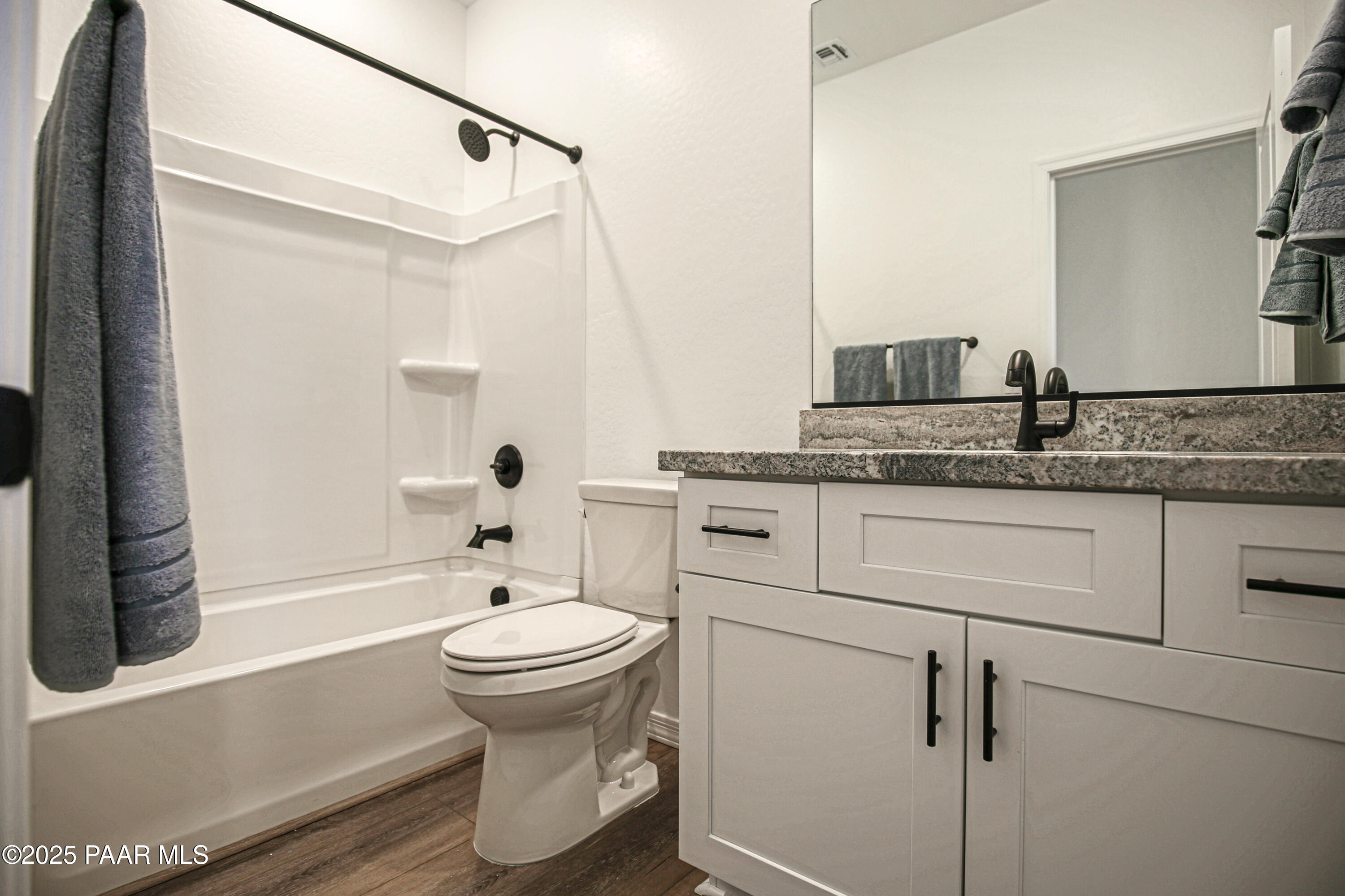 1224 Woodchute Road Prescott, AZ 86305 - Photo 33 of 43 a bathroom with a granite countertop sink toilet and shower