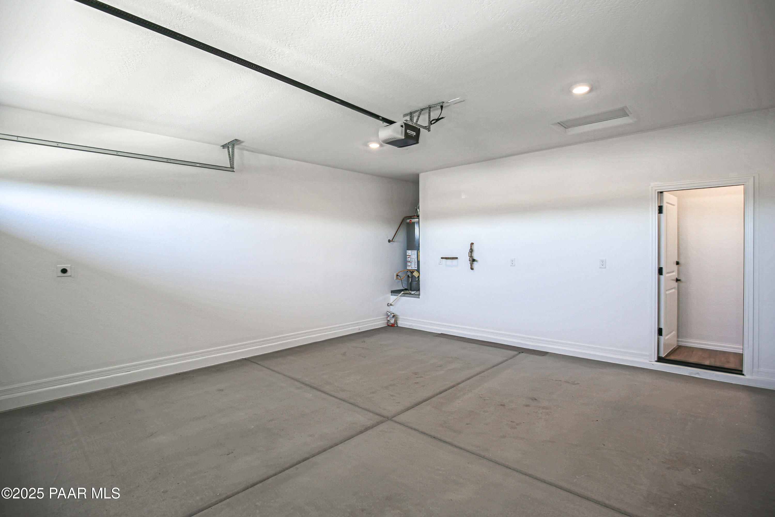 1224 Woodchute Road Prescott, AZ 86305 - Photo 43 of 43 an empty room with white walls and empty racks