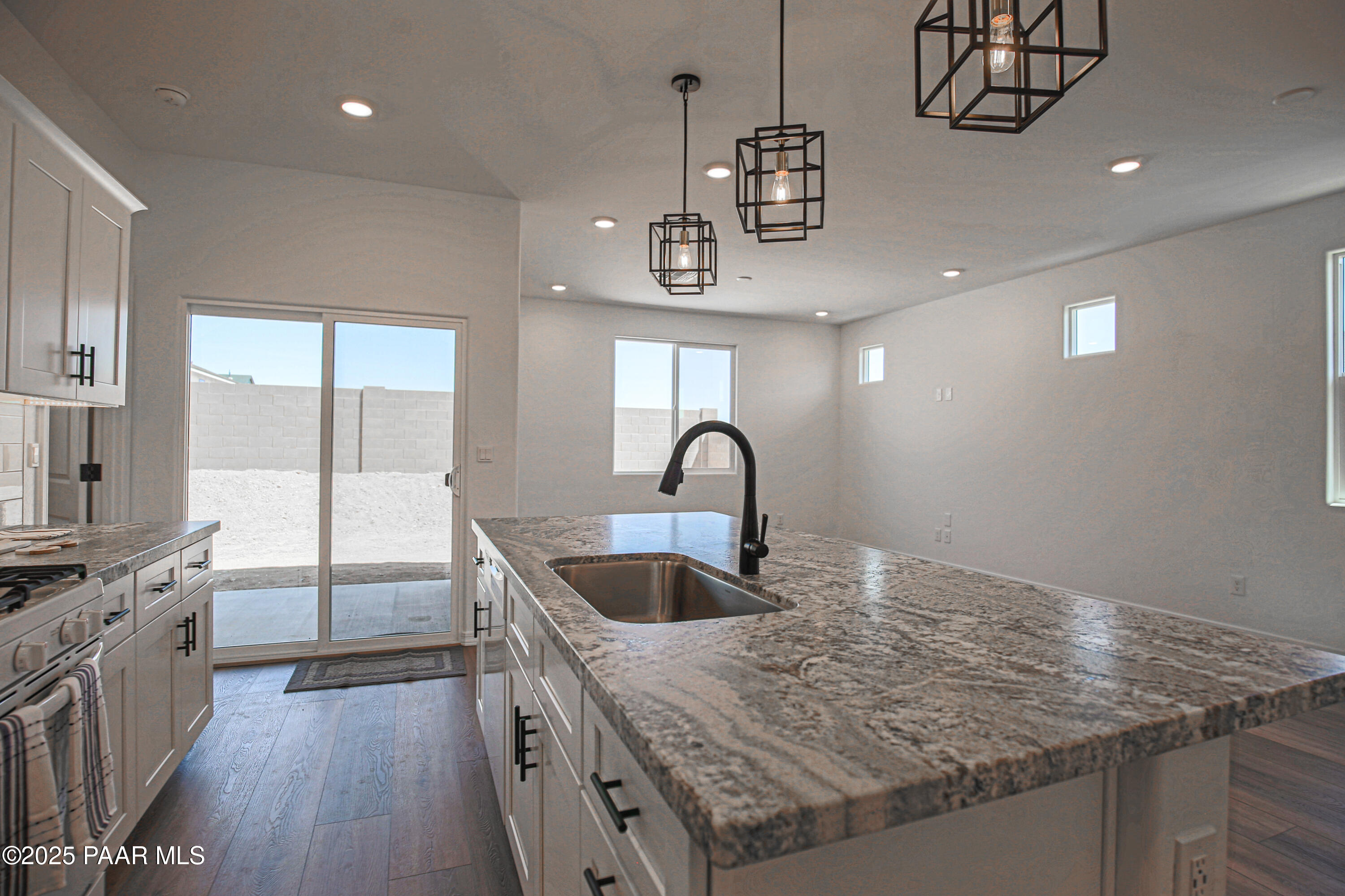 1224 Woodchute Road Prescott, AZ 86305 - Photo 9 of 43 a kitchen with stainless steel appliances granite countertop a sink a counter space and a window