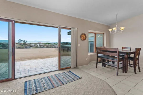 a dining room with furniture and window