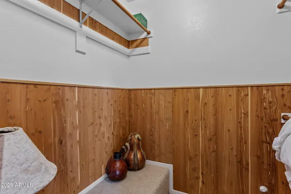 a bathroom with a granite countertop sink a toilet and a mirror