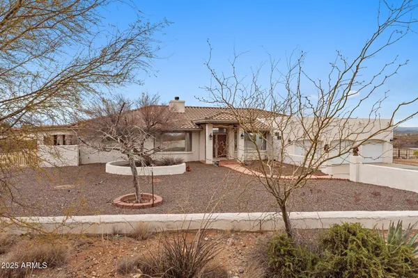 an aerial view of a house with a ocean view