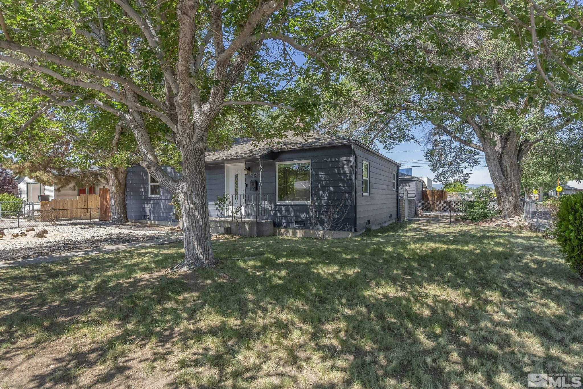 1005 Cordone Avenue Reno, NV 89502 - Photo 2 of 25 a backyard of a house with lots of green space