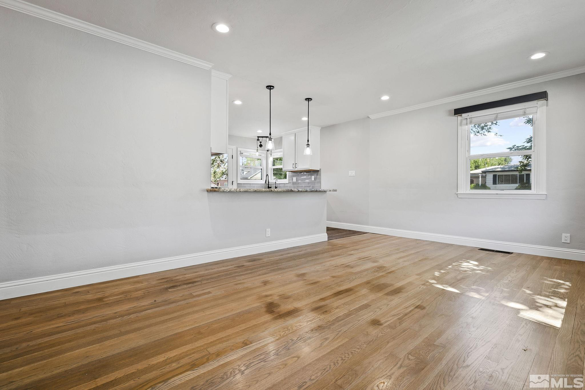 1005 Cordone Avenue Reno, NV 89502 - Photo 3 of 25 a view of a kitchen with wooden floor and a window
