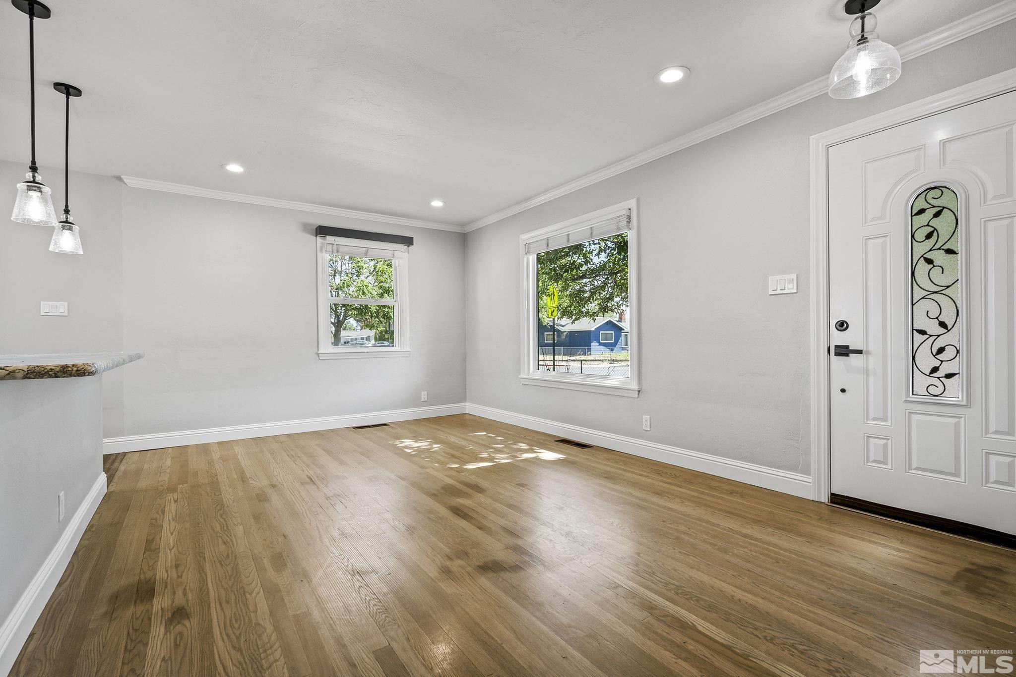 1005 Cordone Avenue Reno, NV 89502 - Photo 4 of 25 an empty room with windows and closet