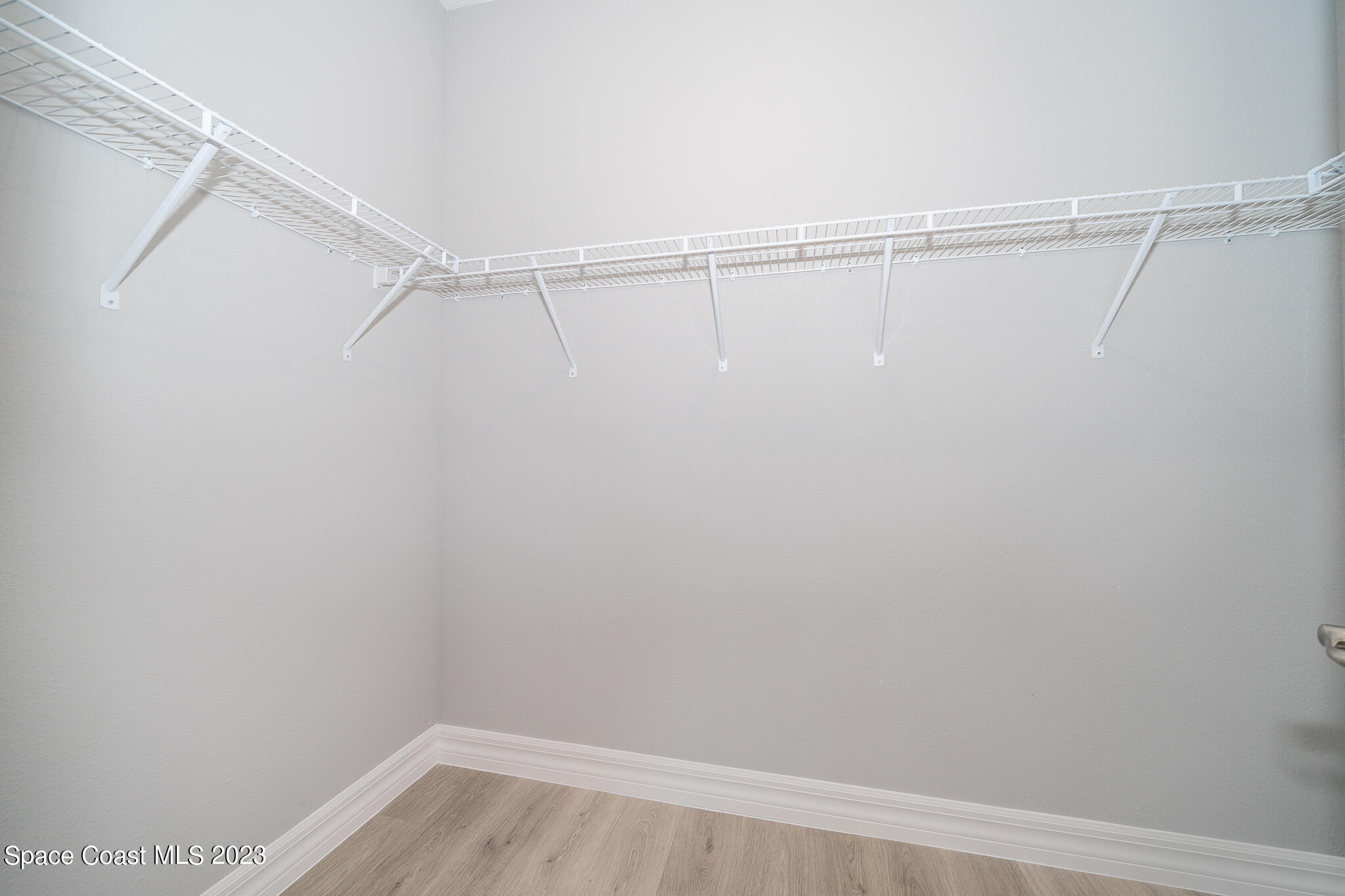 209 Tatum Road Southwest Palm Bay, FL 32908 - Photo 18 of 27 a view of a room with racks on the wall