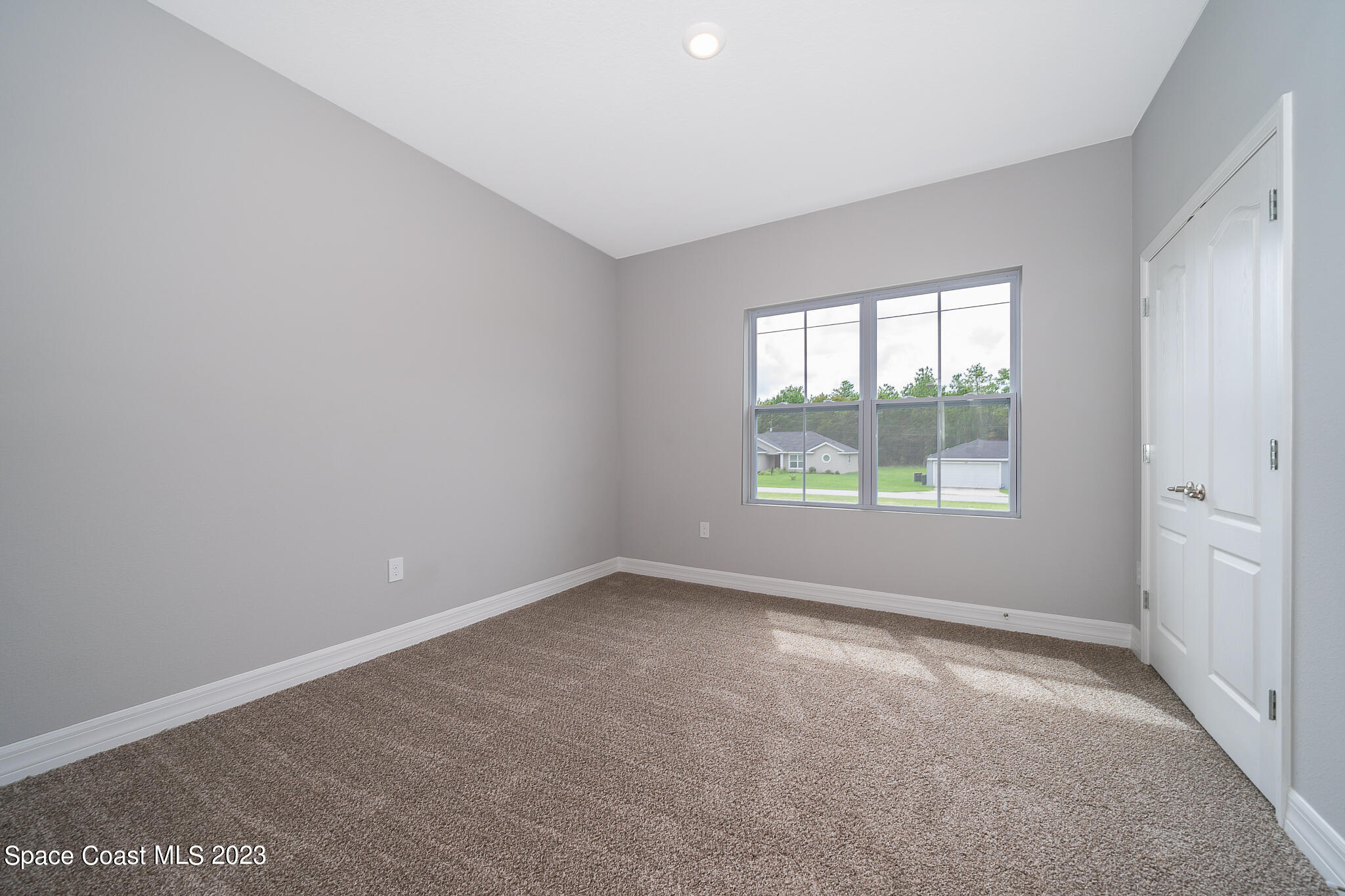 209 Tatum Road Southwest Palm Bay, FL 32908 - Photo 20 of 27 an empty room with windows