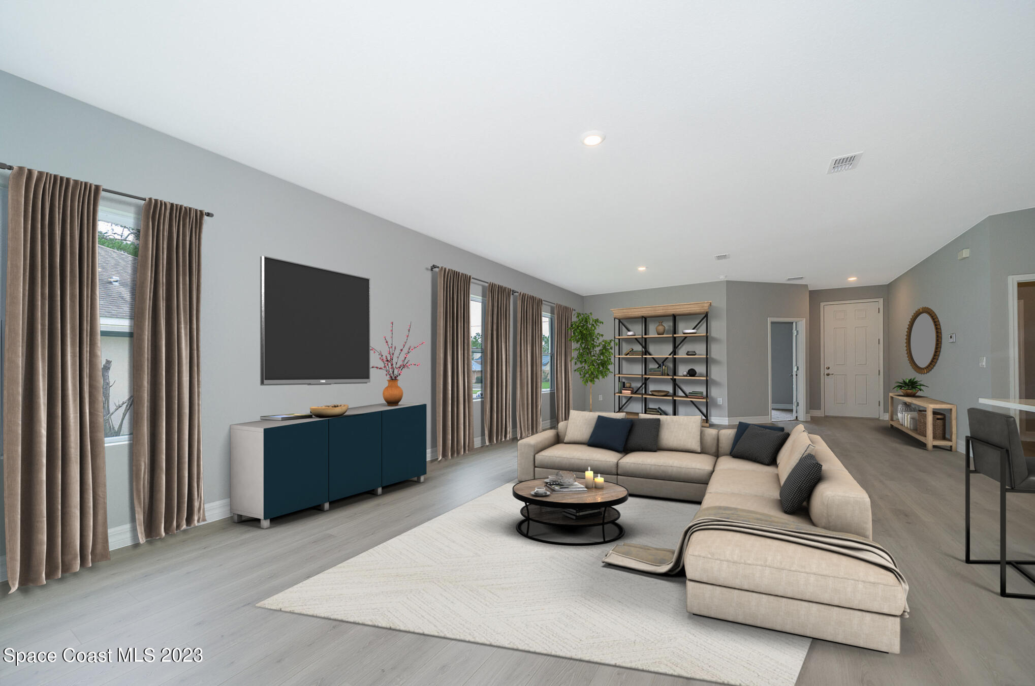 209 Tatum Road Southwest Palm Bay, FL 32908 - Photo 8 of 27 a living room with furniture and a flat screen tv