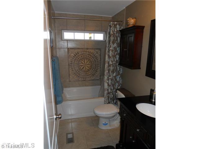 2296 Beckner Road Lexington, NC 27292 - Photo 7 of 16 Master Bath/Spa. Master Bath With Beautiful Tile On the Floor And Shower Walls