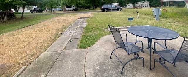 4-87 Woodhaven Sublette, IL 61367 - Photo 2 of 3 a backyard of a house with yard and outdoor seating