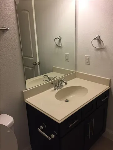 a bathroom with a sink and a toilet