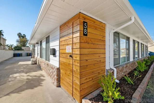 a view of a pathway along the house