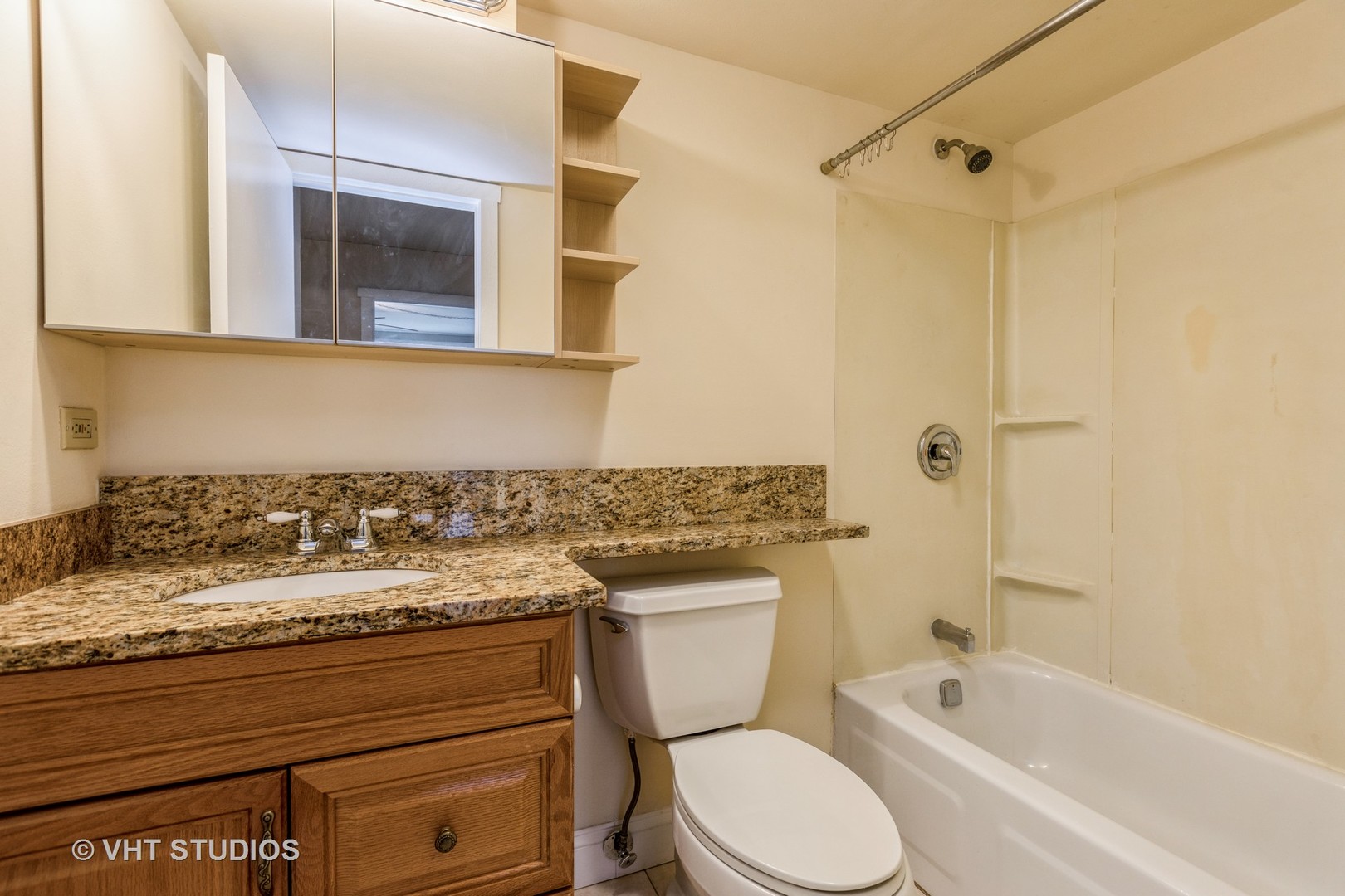 1 Renaissance Place, Unit 1216 Palatine, IL 60067 - Photo 13 of 16 a bathroom with a granite countertop toilet sink and mirror