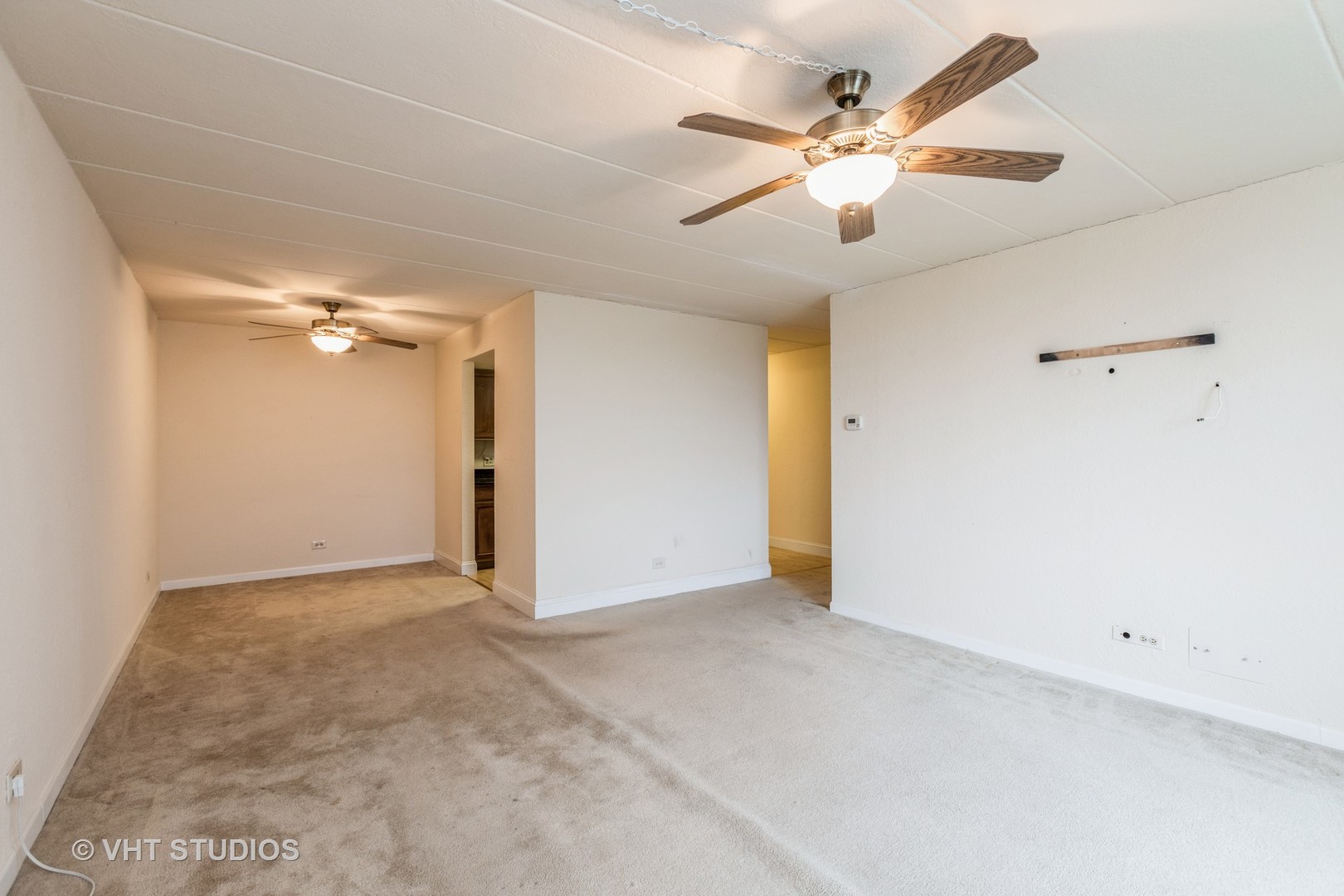1 Renaissance Place, Unit 1216 Palatine, IL 60067 - Photo 8 of 16 a view of an empty room with a ceiling fan
