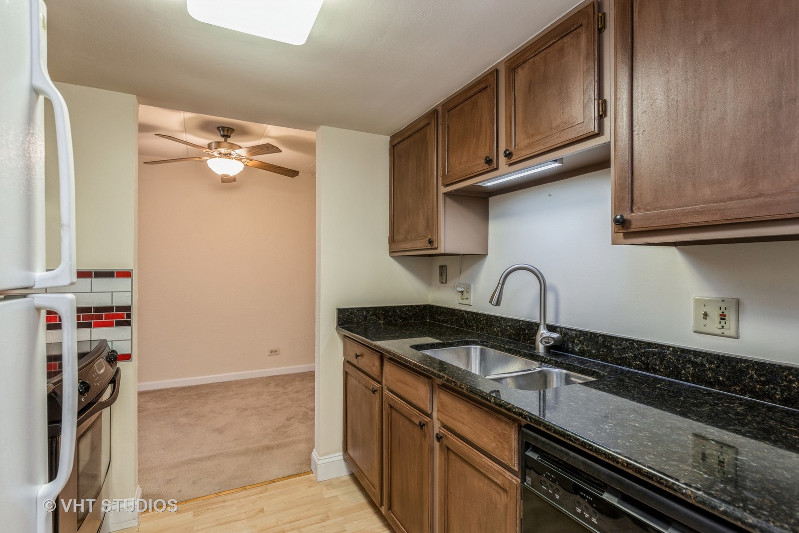 1 Renaissance Place, Unit 1216 Palatine, IL 60067 - Photo 10 of 16 a kitchen with stainless steel appliances granite countertop a sink stove and cabinets