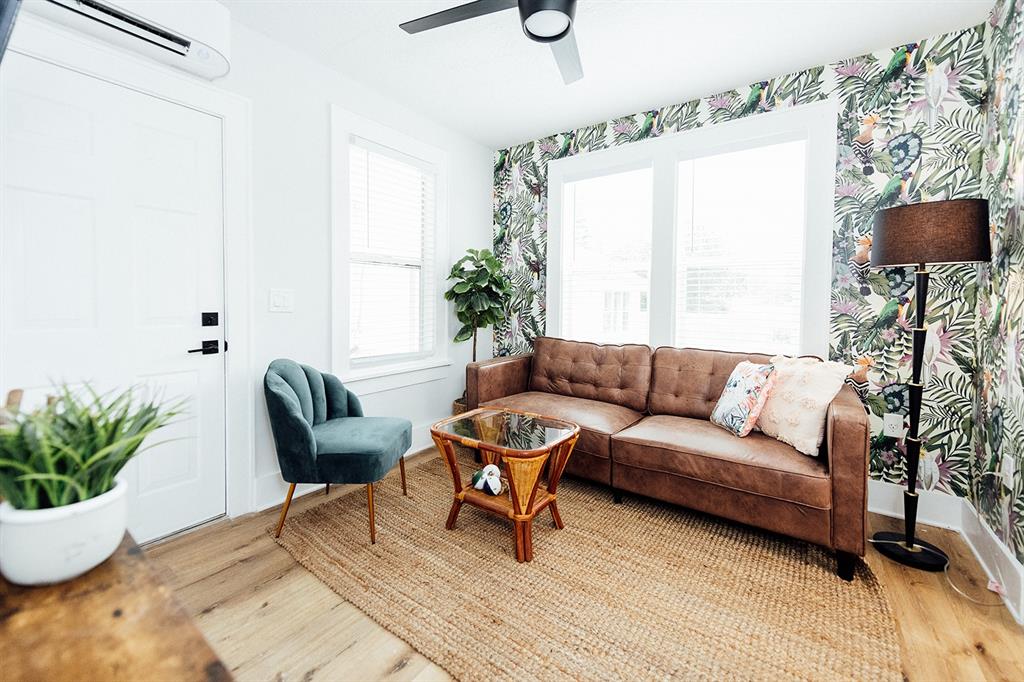 809 10th Avenue North, Unit 3 St. Petersburg, FL 33701 - Photo 3 of 47 a living room with furniture and a potted plant