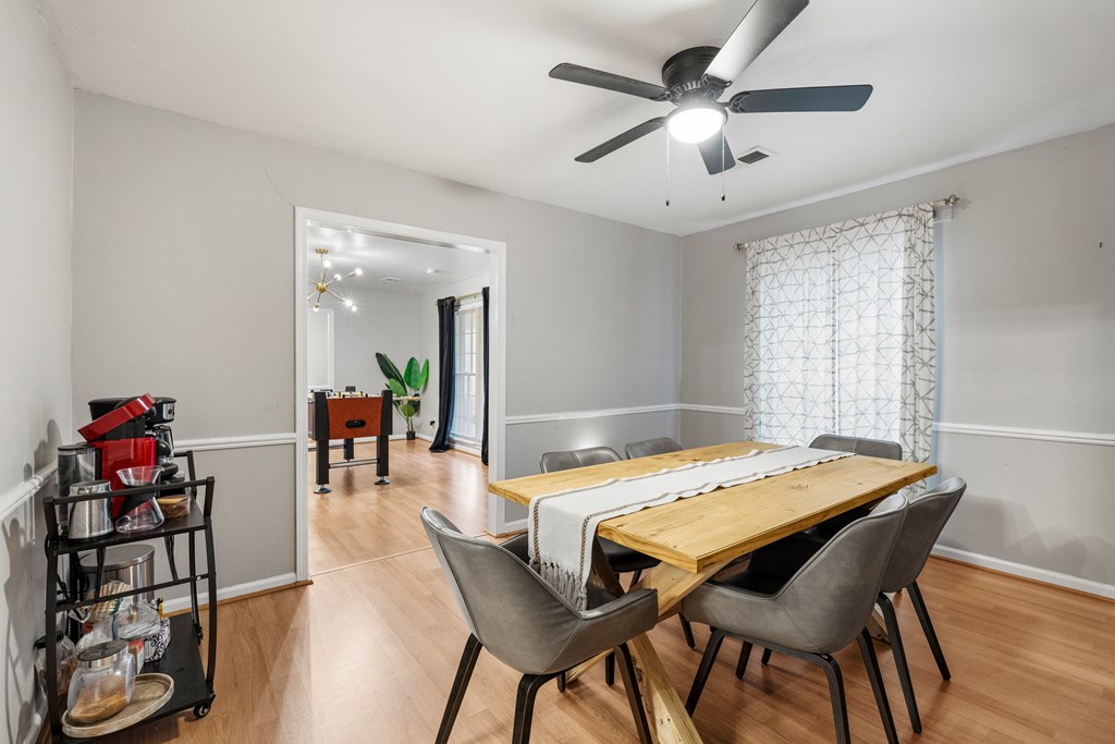 7310 Macon Road Columbus, GA 31907 - Photo 15 of 28 a dining room with furniture and window