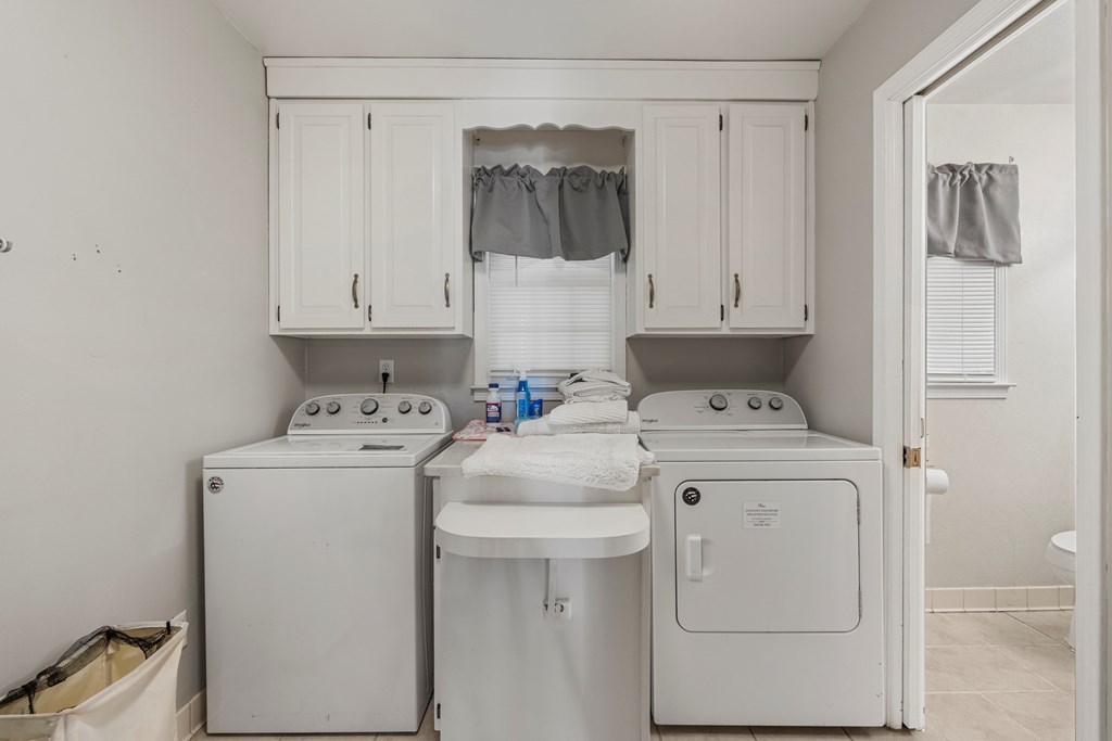 7310 Macon Road Columbus, GA 31907 - Photo 24 of 28 a utility room with dryer and washer