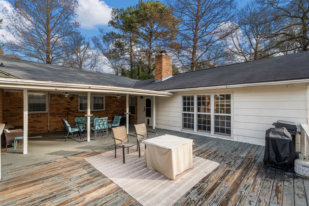7310 Macon Road Columbus, GA 31907 - Photo 5 of 28 a front view of house with deck outdoor seating and green space