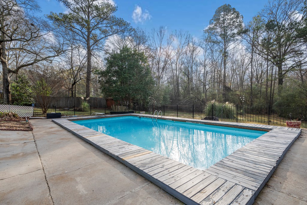 7310 Macon Road Columbus, GA 31907 - Photo 7 of 28 a view of a swimming pool with a patio