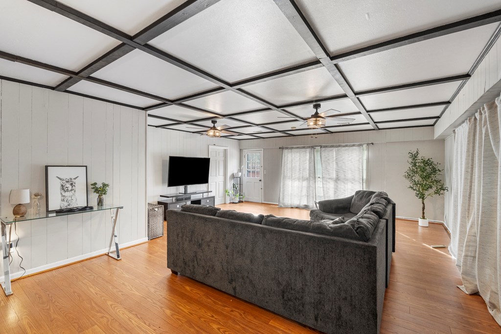 7310 Macon Road Columbus, GA 31907 - Photo 9 of 28 a living room with furniture and a flat screen tv