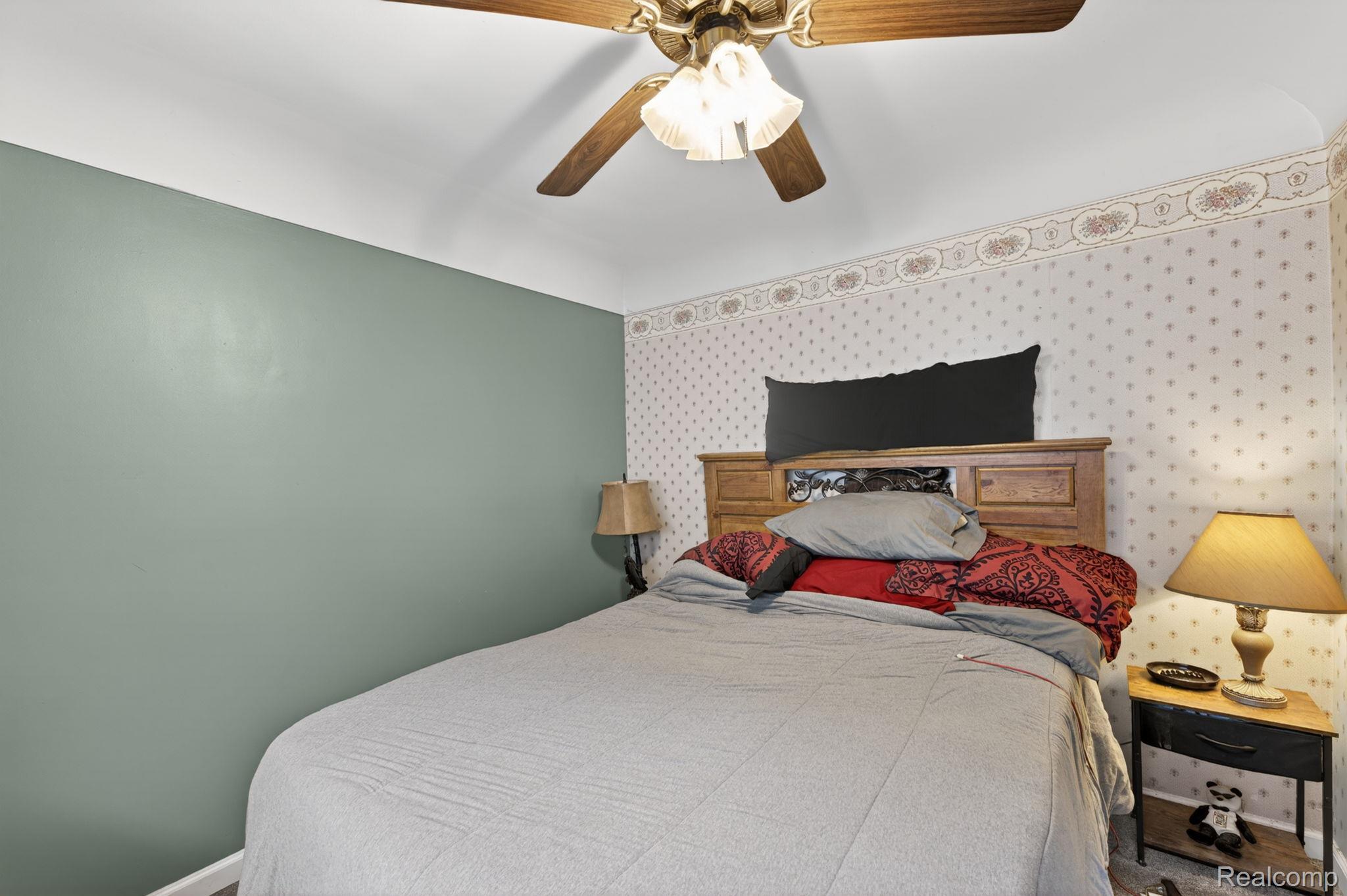 304 West Ridge Street Owosso, MI 48867 - Photo 15 of 45 Bedroom featuring wallpapered walls and a ceiling fan