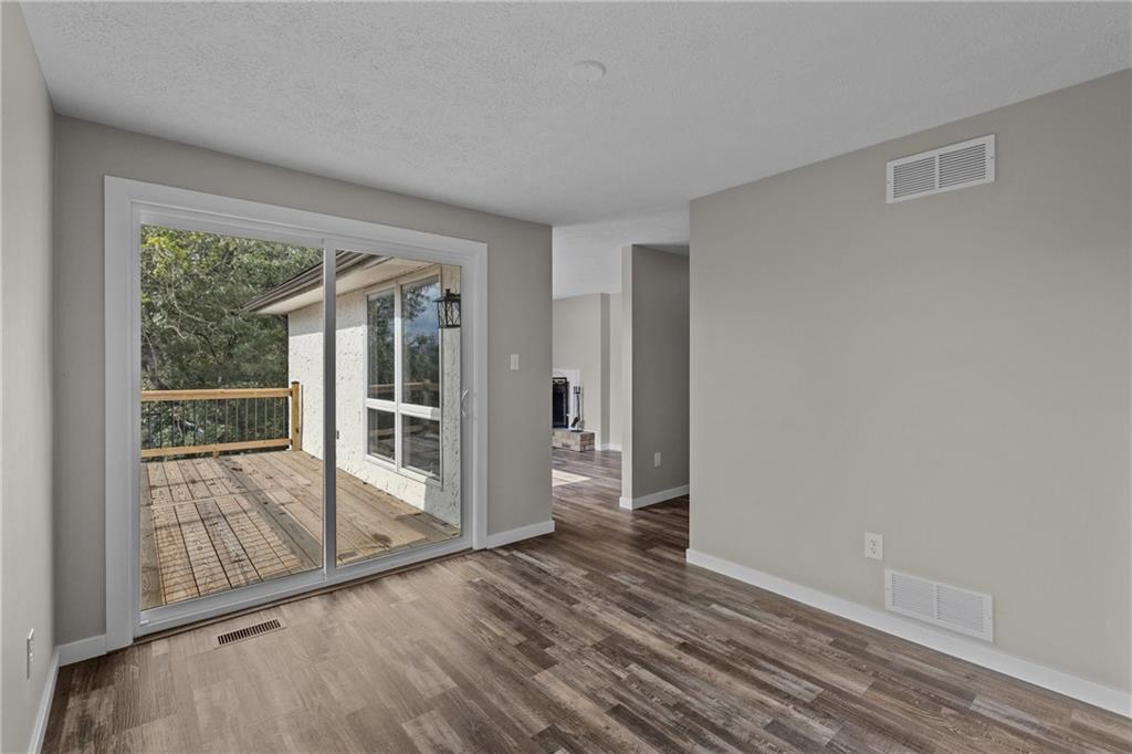 7440 Noblestown Road McDonald, PA 15057 - Photo 16 of 38 a view of empty room with wooden floor and fan