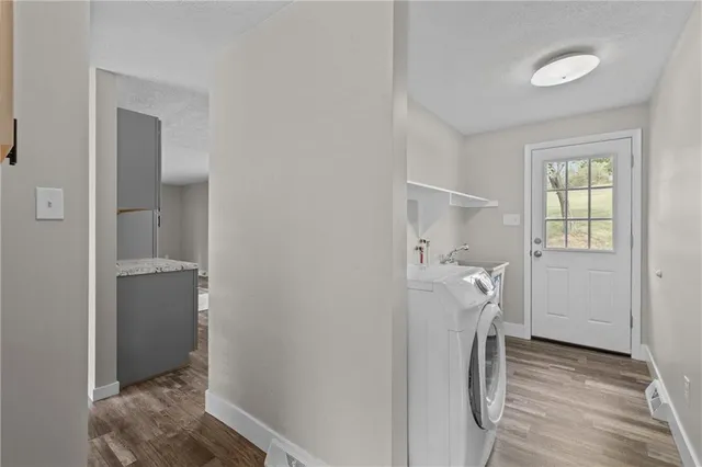 a view of entryway with hallway and wooden floor