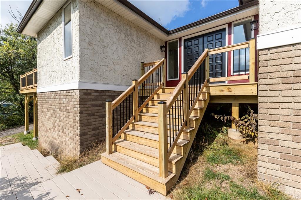 7440 Noblestown Road McDonald, PA 15057 - Photo 2 of 38 a view of staircase with wooden floor and white walls