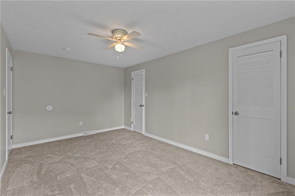 7440 Noblestown Road McDonald, PA 15057 - Photo 23 of 38 a view of an empty room with a fan
