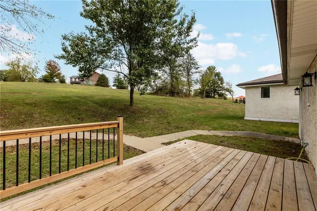 a view of a backyard with wooden floor