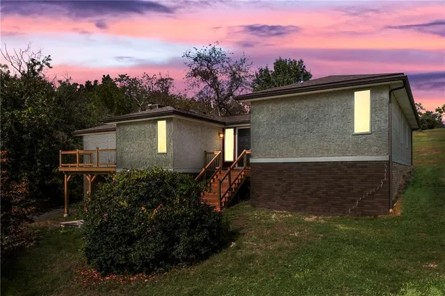 a backyard of a house with lots of green space