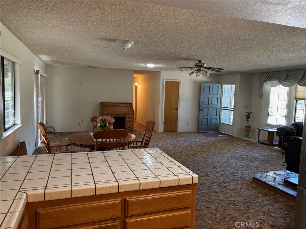 4918 Indian Peak Road Mariposa, CA 95338 - Photo 13 of 39 a bedroom with a bed and window