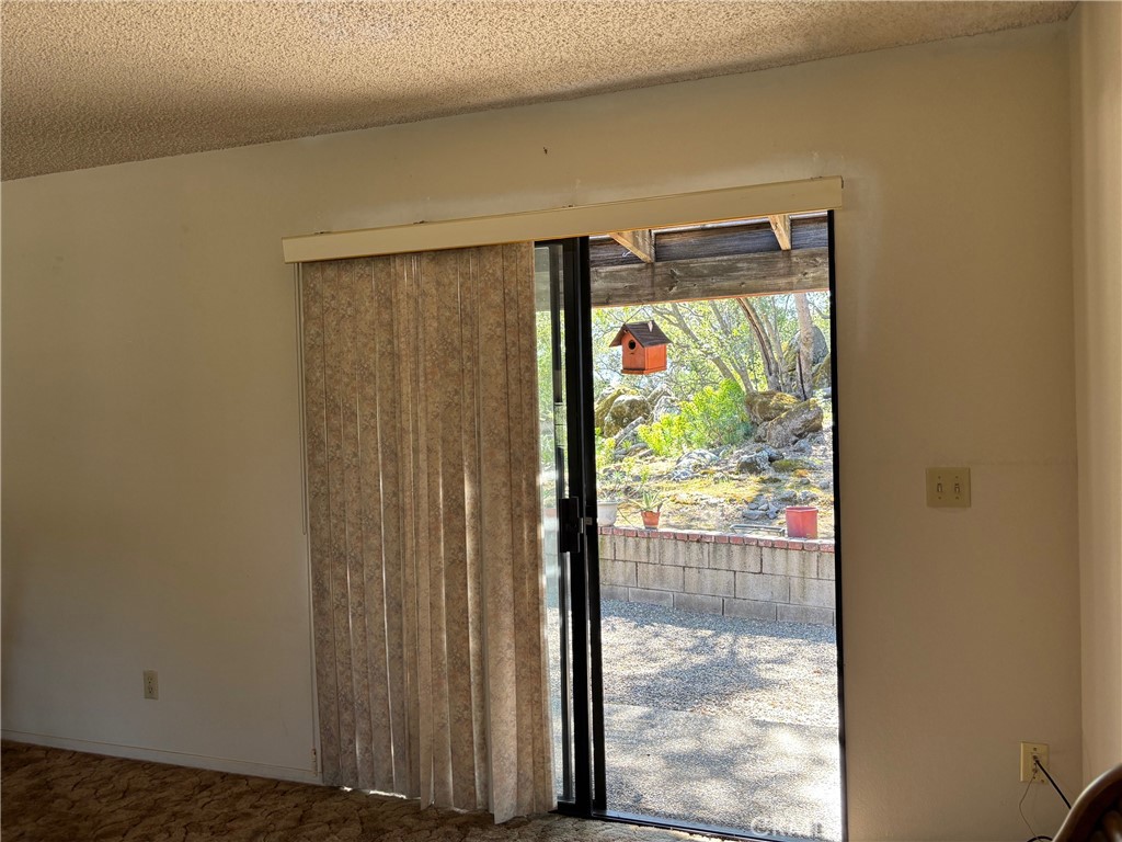 4918 Indian Peak Road Mariposa, CA 95338 - Photo 14 of 39 a view of a back yard from a room