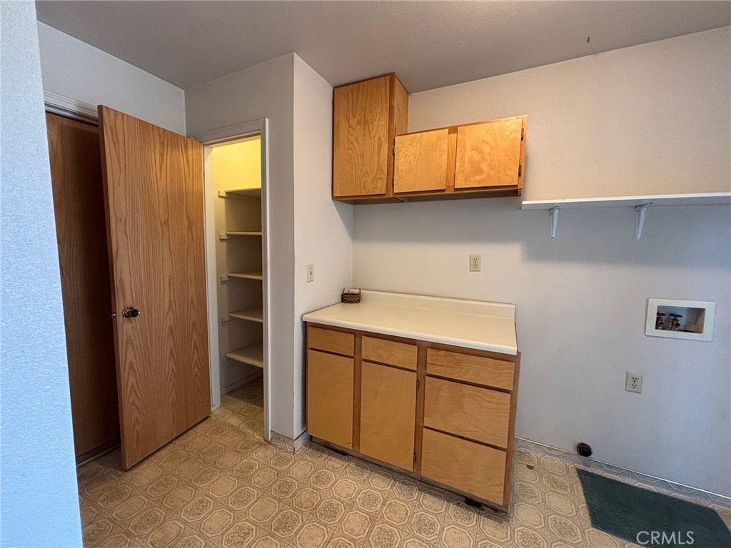 4918 Indian Peak Road Mariposa, CA 95338 - Photo 15 of 39 a utility room with cabinets