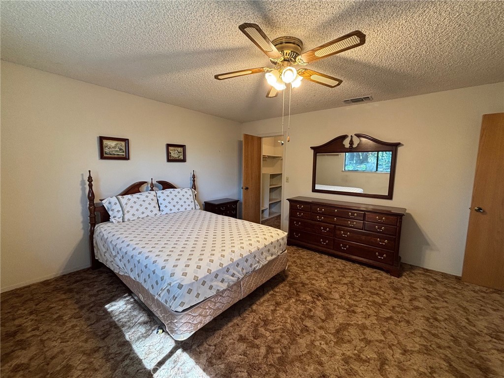 4918 Indian Peak Road Mariposa, CA 95338 - Photo 19 of 39 a bedroom with a bed and a dresser