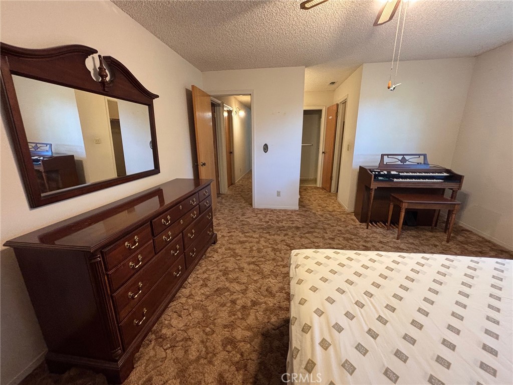 4918 Indian Peak Road Mariposa, CA 95338 - Photo 21 of 39 a living room with a couch and a dresser