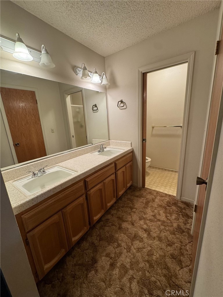 4918 Indian Peak Road Mariposa, CA 95338 - Photo 22 of 39 a bathroom with a double vanity sink mirror and double