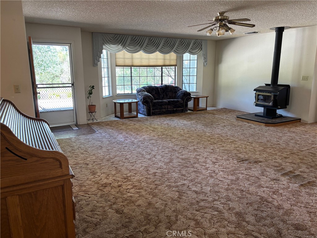 4918 Indian Peak Road Mariposa, CA 95338 - Photo 8 of 39 a living room with furniture and a window