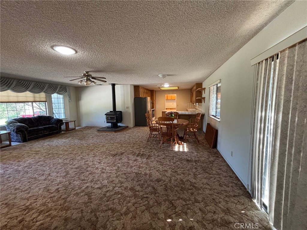 4918 Indian Peak Road Mariposa, CA 95338 - Photo 9 of 39 a living room with furniture and a window