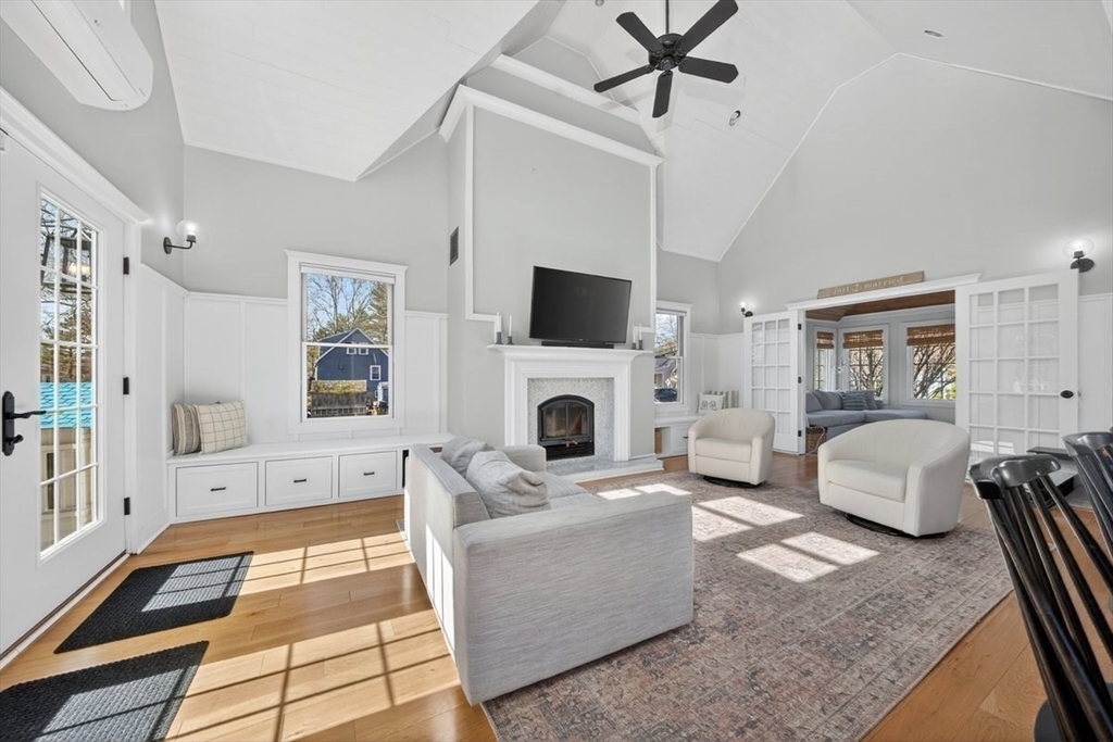 12 Tupelo Road Cohasset, MA 02025 - Photo 11 of 35 a living room with furniture a flat screen tv and a fireplace