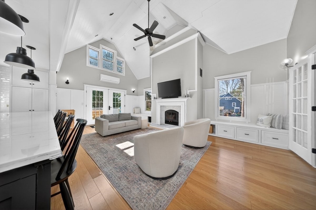12 Tupelo Road Cohasset, MA 02025 - Photo 15 of 35 a living room with fireplace furniture and a table