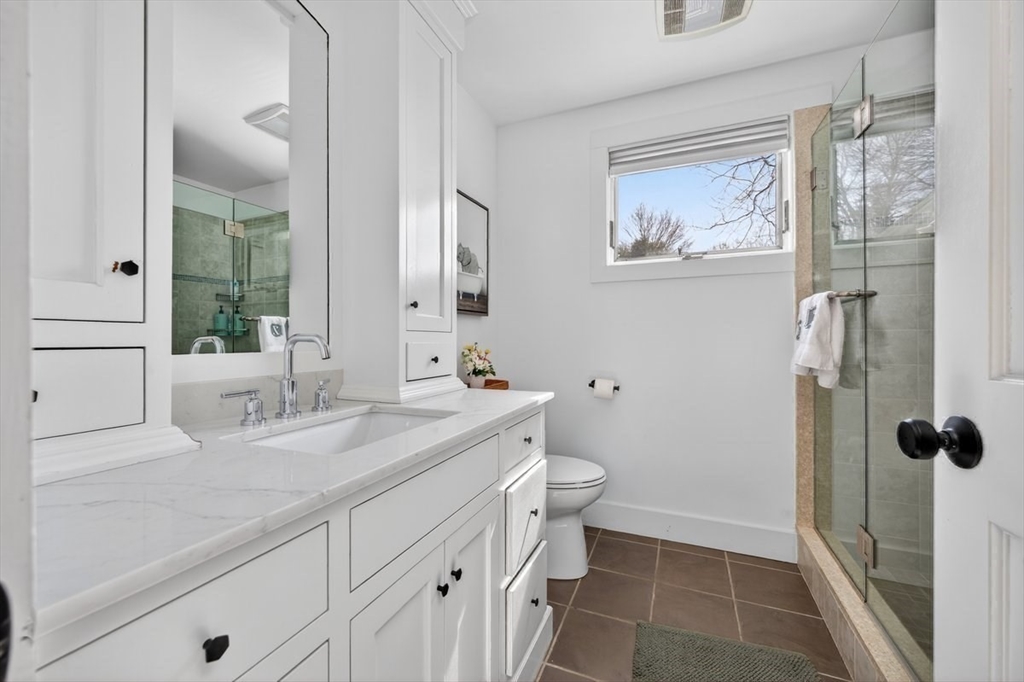 12 Tupelo Road Cohasset, MA 02025 - Photo 18 of 35 a bathroom with a granite countertop sink toilet and shower