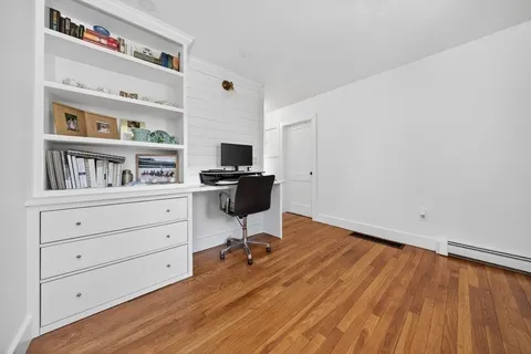 a view of a hallway with a white walls