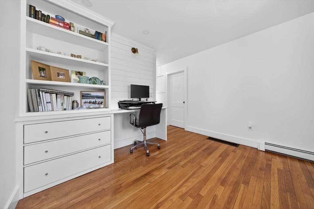 12 Tupelo Road Cohasset, MA 02025 - Photo 20 of 35 a view of workspace with wooden floor shelves
