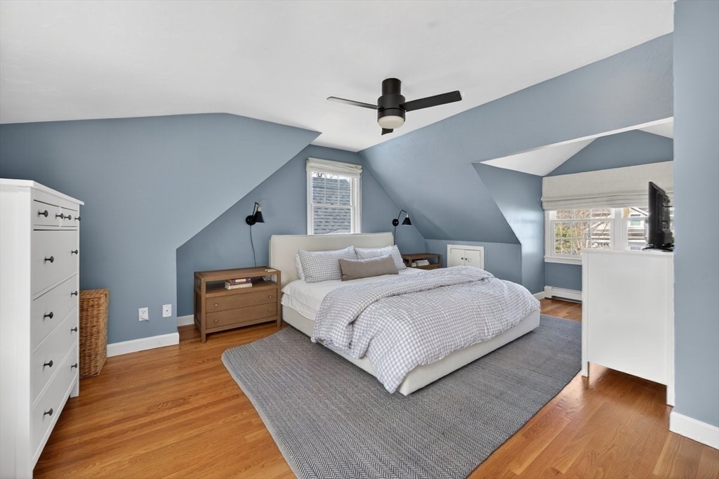 12 Tupelo Road Cohasset, MA 02025 - Photo 23 of 35 a spacious bedroom with a bed and wooden floor