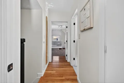a view of a hallway with washer and dryer