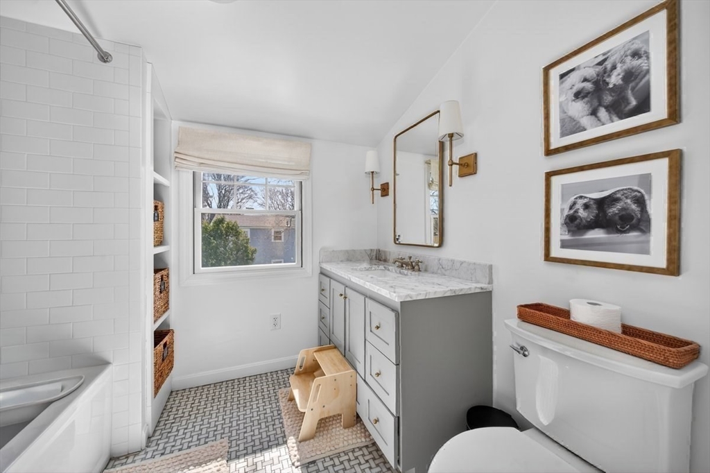 12 Tupelo Road Cohasset, MA 02025 - Photo 25 of 35 a bathroom with a granite countertop sink a toilet and a window